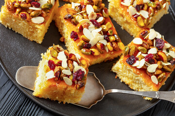 slices of yogurt cake with nuts and dried berries