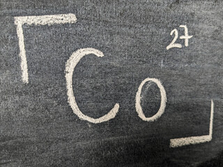 The chemical element is cobalt with a serial number from the periodic table. Chalk drawing.