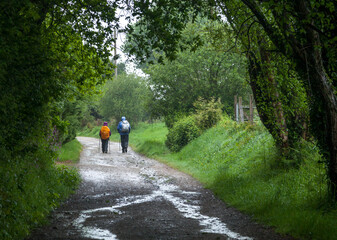 Two backpackers on a dirt road