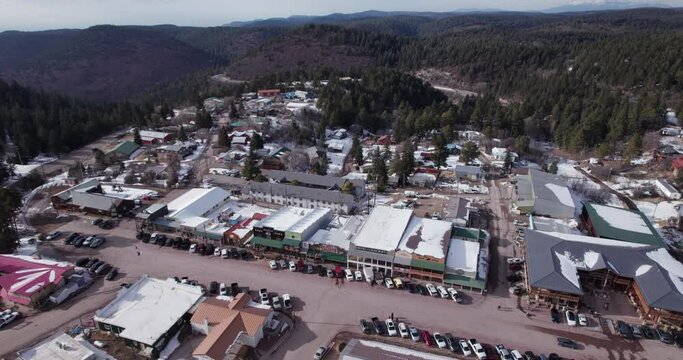 Aerial drone shot of Cloudcroft, New Mexico Main Street, pull back and tilt up