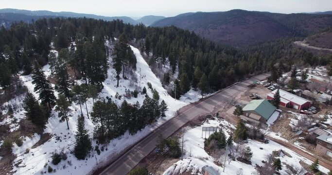 Aerial drone shot of road in to Cloudcroft, New Mexico, boom up