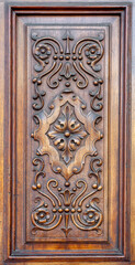 Carved wooden panel on a door