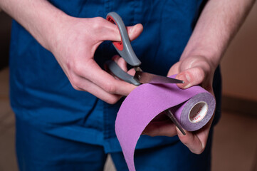 A rehabilitation doctor taps a foot and ankle to a young patient