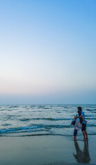 Happy couple on vacation time enjoys the summer. Couple Fun On Beach. Romantic People In Love On sea beach.
