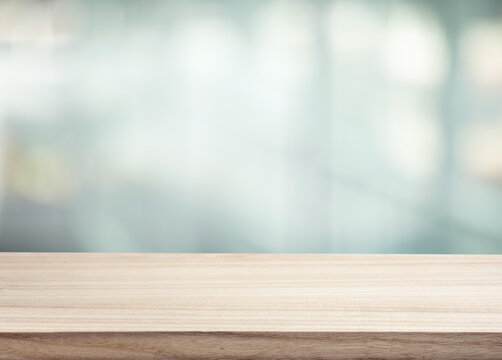 Selective focus.Top of wood  table with window glass background