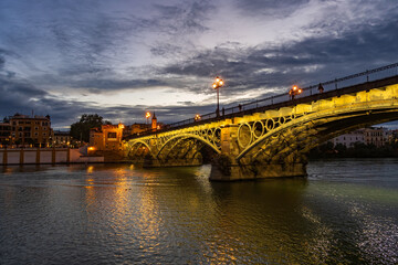 Evening at Triana Bridge in Seville - 750499485