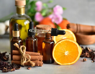 Essential oils with orange on dark bottles