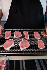 Meat laid out on a grid from a dehydrator