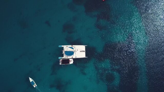 cenital drone shoot of the boats in the caribbean sea in a sunny day