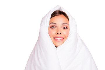 Portrait of young surprised smiling lady covered wrapped in blanket. Isolated over pink pastel background