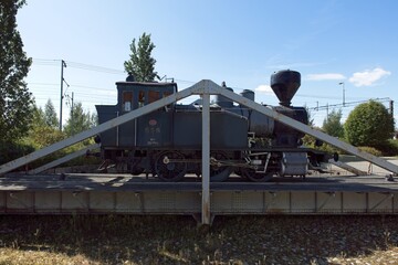 Old steam locomotive on rail turn table.