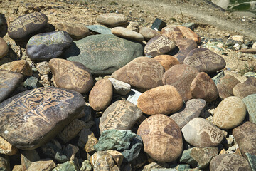 A pile of tibetan mani stones with mantras