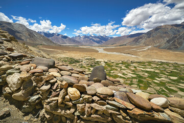 Panoramic view at the Zanskar valley with mani stones at the front view