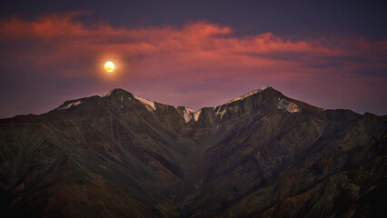 Moon rise over the mountains in Himalayas