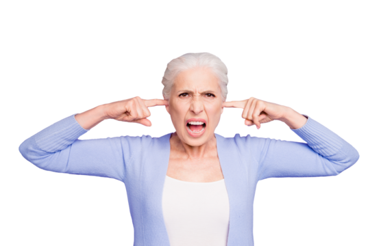 Beautiful angry gray-haired old lady wearing casual, closing her ears with fingers, yelling. Isolated over pastel violet purple background