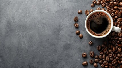 Top view of a freshly brewed espresso in a white cup with scattered coffee beans on a gray surface. - obrazy, fototapety, plakaty