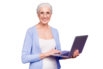 Grey haired old nice beautiful cheerful smiling woman wearing spectacles holding laptop learning online course. Isolated over violet purple background