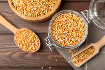 Green buckwheat in a bowl on a wooden kitchen table.Superfood.Raw buckwheat porridge.Healthy vegan food concept, eco products, diet. Copy space.Organic food.weight loss and proper nutrition.