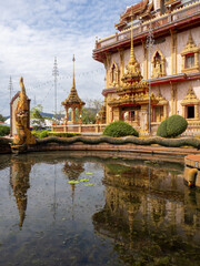 Pond with Naga decoration on the grounds of Wat Chalong temple - Phuket, Thailand