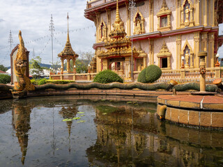 Pond with Naga decoration on the grounds of Wat Chalong temple - Phuket, Thailand