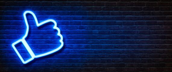 Neon sign on a brick wall - Thumb up