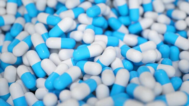 Blue and white capsules in a close-up, 3D animation