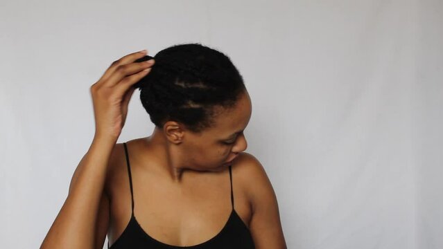 Black woman with her natural 4c hair on a white background