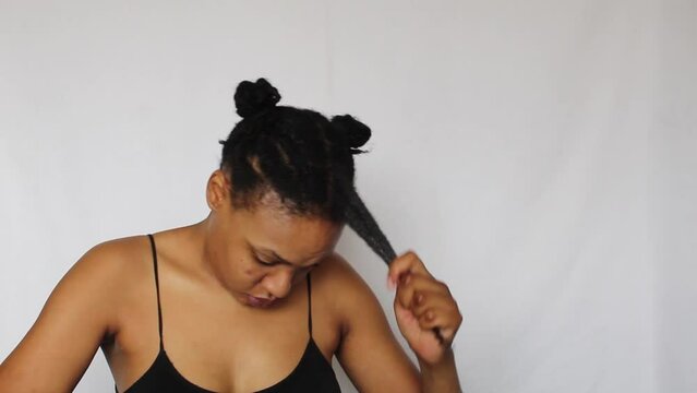 Black woman with twists her natural 4c hair on a white background