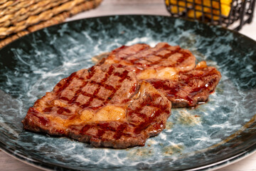 Freshly grilled beef entrecote steak. Delicious ribeye slice cooked on a plate. high quality photo