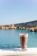 chocolate shake and coffee on the beach. Refreshment in summer holidays