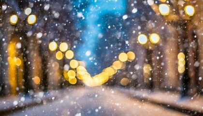 Fototapeta na wymiar beautiful blurred street of festive night or evening city with snowfall and christmas lights abstract christmas defocused background