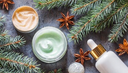 Obraz na płótnie Canvas christmas spa and wellness composition with creams fir branches aromatherapy and winter skin care lifestyle concept invitation and advertising salon flat lay