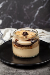 Chocolate magnolia dessert. Magnolia dessert with chocolate filling on a dark background. Close up