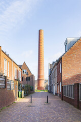 Modern newly build houses surrounding the old towers of the ENKA factory in Ede, Gelderland...