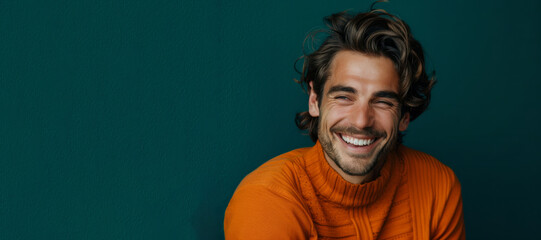Obraz premium A man with a smile on his face is wearing a yellow shirt. He is looking at the camera and he is happy. Ultra handsome man, smiling and laughing, wearing bright clothes. Bright solid dark background