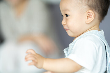 Portrait of enjoy happy love family asian mother playing with adorable little asian baby newborn...