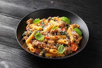 Creamy Tuscan pasta with minced beef, sun dried tomatoes, spinach and parmesan cheese