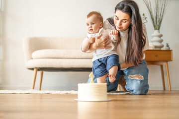 Woman Playing With Baby on Floor