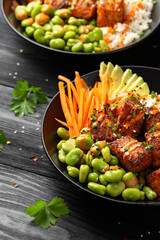 Firecracker salmon poke bowl with edamame, avocado carrot and rice