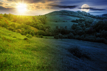 landscape with meadow near the forested hill of mountainous rural area with sun and moon at spring...