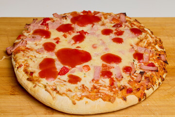 pizza cooked on a wooden board