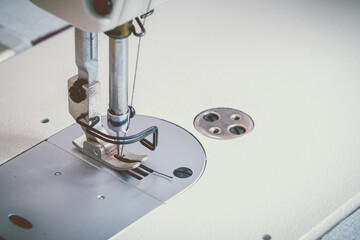 Abstract Sewing machine and thread rolling. - obrazy, fototapety, plakaty
