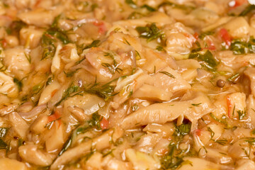 stew mushrooms (Pleurotus) in a pan while they are being cooked.