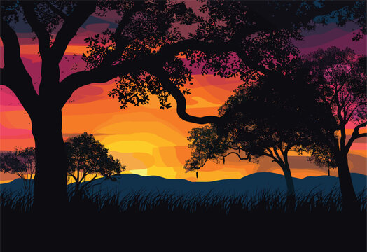 A picturesque sunset with trees silhouetted in the foreground, majestic mountains in the background, and a colorful afterglow painting the sky