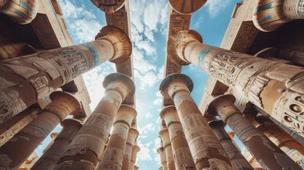 Foto op Plexiglas Low angle of old carved ornamental columns and ceiling inside of great hypostyle hall of ancient karnak temple complex in egypt  © Emil
