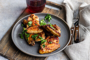 Roasted spicy chicken wings with coriander and cocktail