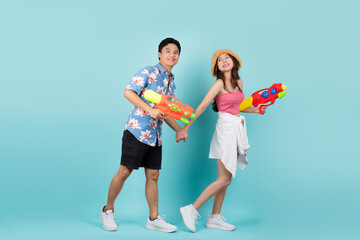 Obraz premium Full body shot of asian people are using water guns play in the Songkran festival. Studio concept