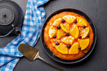Sweet cake with orange slices and berries