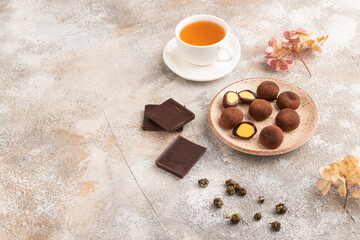 Japanese rice chocolate mochi filled with cream on brown concrete. side view, copy space.