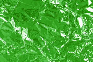 Green lime foil shiny texture, abstract wrapping paper for background and design art work.
